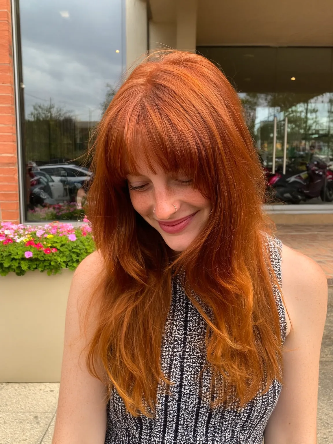 Long Copper Layers with Curtain Bangs and Heart-Flattering Waves